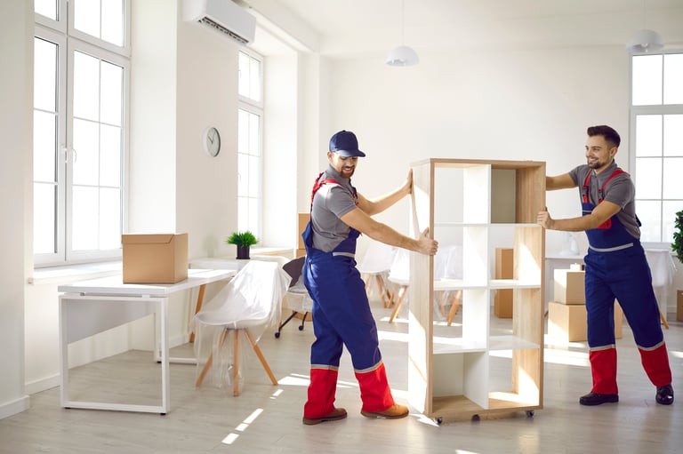 Office furniture and workspace items being cleared for removal